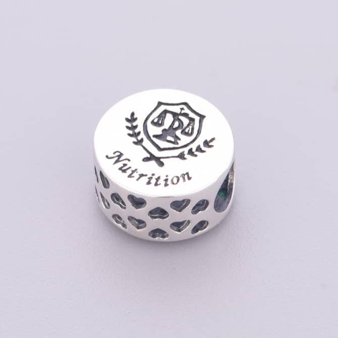 Nutrition Symbol with Green Crystals Charm